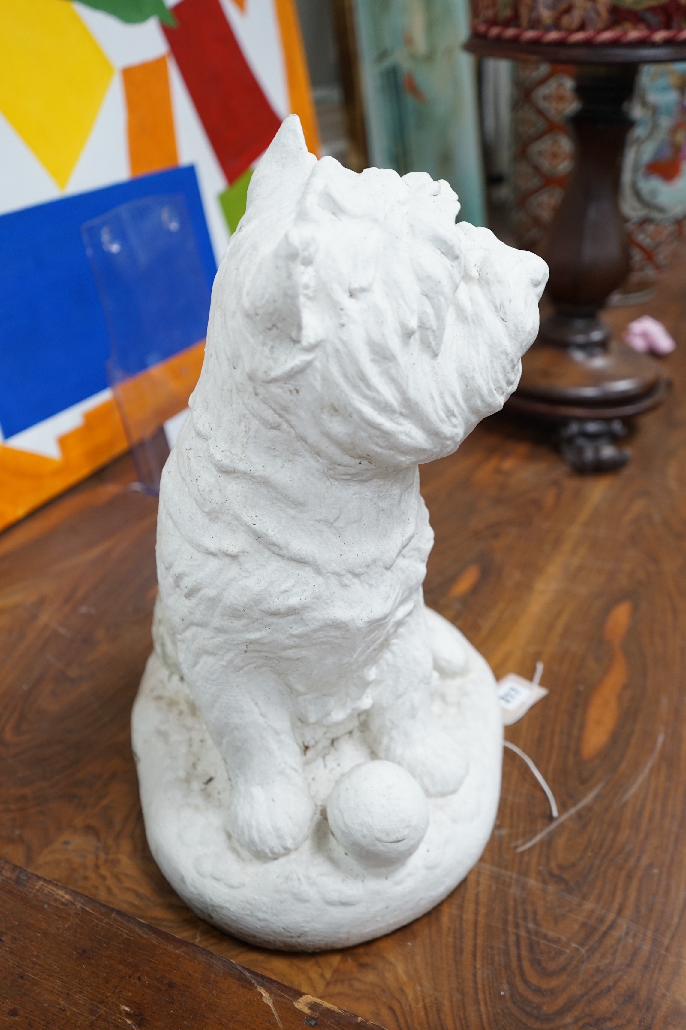 A painted carved stone model of a Scottish terrier, height 46cm
